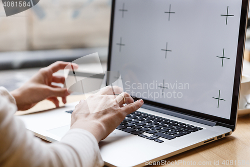 Image of Woman holding credit card and typing