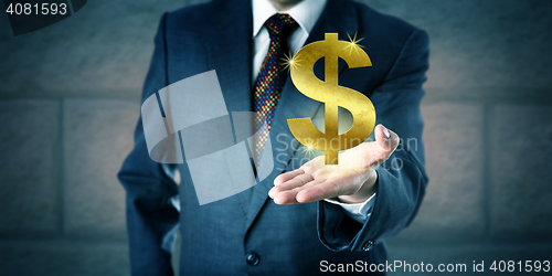 Image of Business Manager Offering A Golden Dollar Symbol