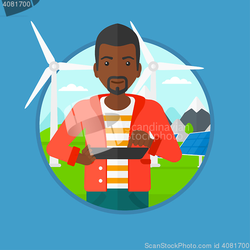 Image of Male worker of solar power plant and wind farm.