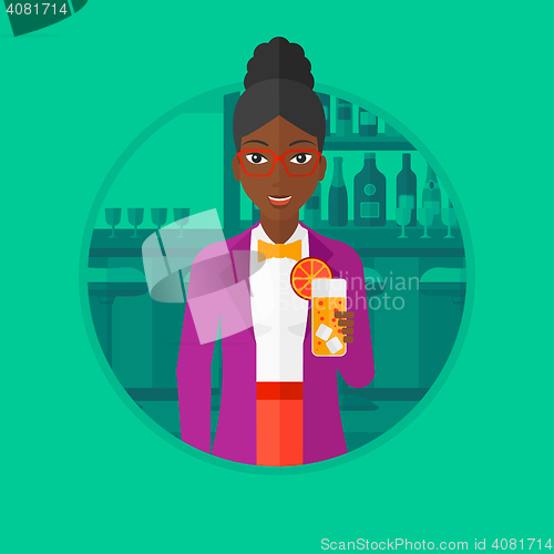 Image of Woman drinking orange cocktail at the bar.