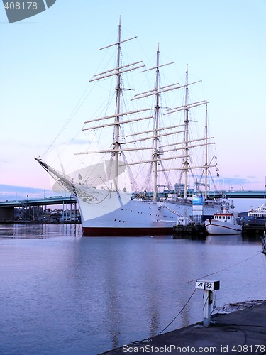 Image of sail ship in the harbour in beautiful sunset