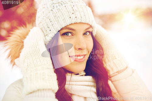 Image of happy woman outdoors in winter