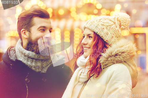 Image of happy couple walking in old town