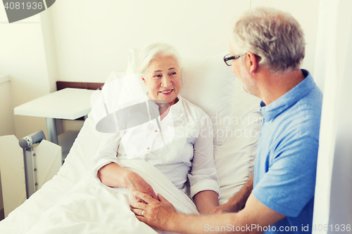 Image of senior couple meeting at hospital ward