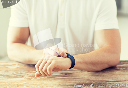 Image of close up of man with heart-rate watch