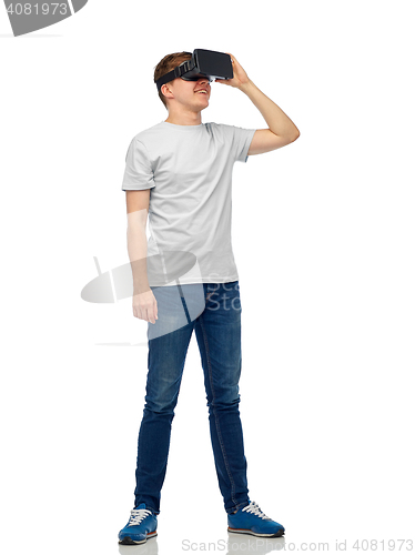 Image of happy man in virtual reality headset or 3d glasses