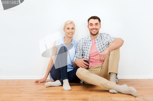Image of happy couple of man and woman to new home