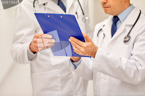 Image of close up of doctors with clipboard at hospital