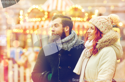 Image of happy couple walking in old town