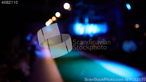 Image of Fashion runway out of focus, blur background.