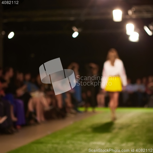 Image of Fashion runway out of focus. The blur background