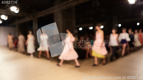 Image of Fashion runway out of focus. The blur background