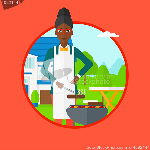 Image of Woman cooking meat on barbecue grill.