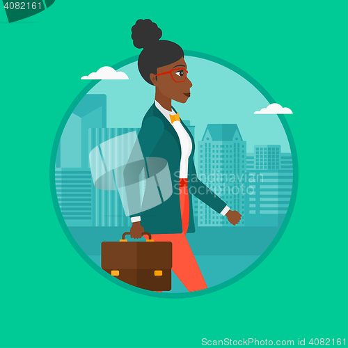 Image of Successful business woman walking with briefcase.