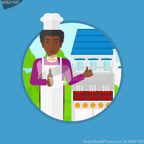 Image of Man cooking meat on gas barbecue grill.