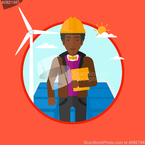 Image of Male worker of solar power plant and wind farm.