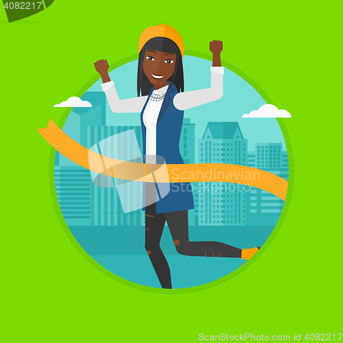 Image of Business woman crossing finish line.