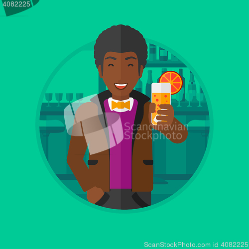 Image of Man drinking orange cocktail at the bar.