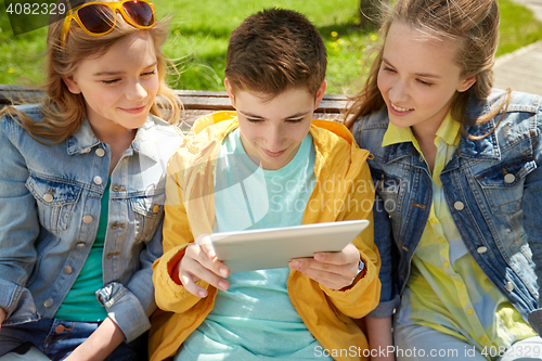 Image of students or friends with tablet pc outdoors