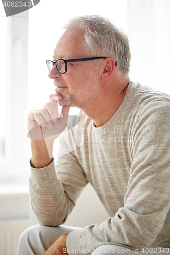 Image of close up of smiling senior man in glasses