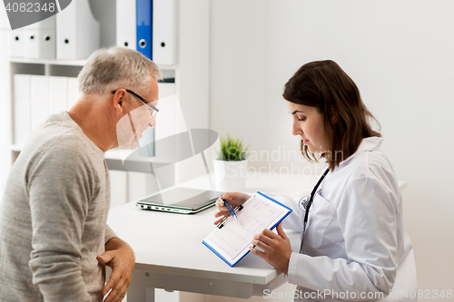Image of senior man and doctor meeting at hospital