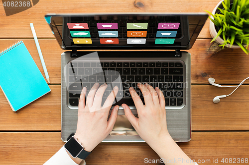 Image of close up of woman or student typing on laptop