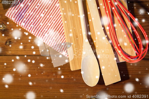 Image of close up of cooking kitchenware on wooden board