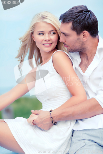 Image of smiling couple at sea side