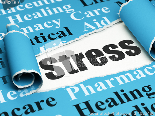 Image of Medicine concept: black text Stress under the piece of  torn paper