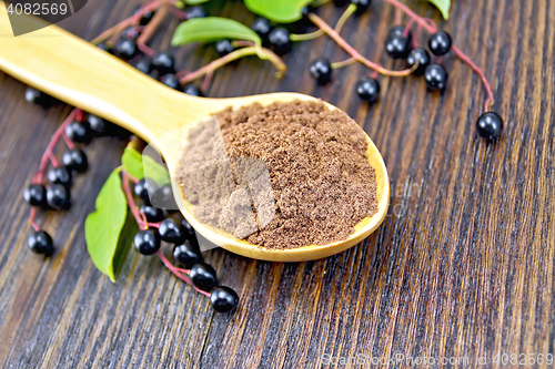 Image of Flour bird cherry in spoon on board