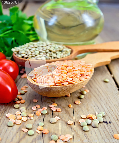 Image of Lentils red in spoon on wooden board