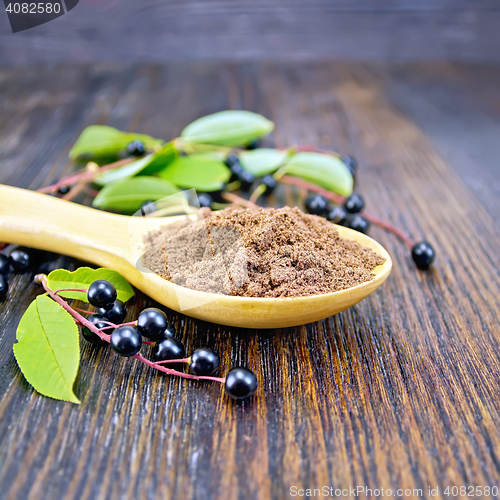 Image of Flour bird cherry in spoon on dark board