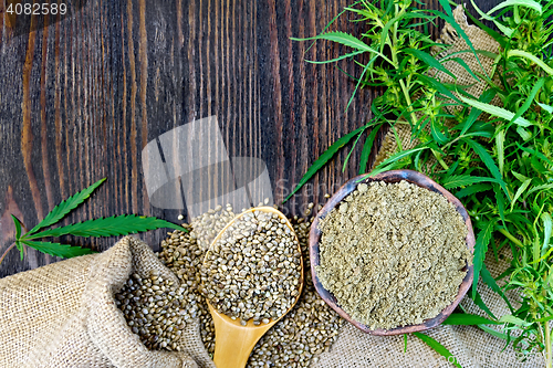 Image of Flour hemp in bowl and corn in spoon on wooden board