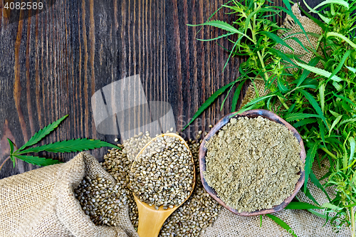 Image of Flour hemp in bowl and corn in spoon on wooden board