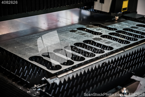 Image of CNC Laser cutting of metal, modern industrial technology.