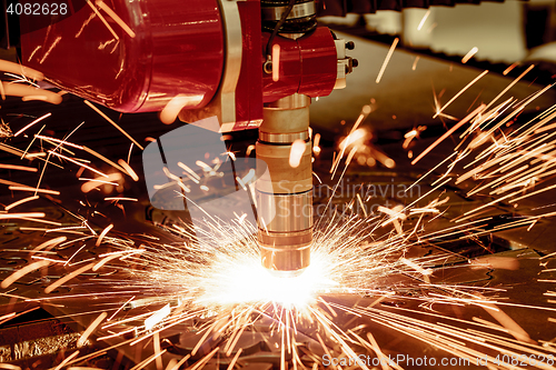 Image of CNC Laser plasma cutting of metal, modern industrial technology.