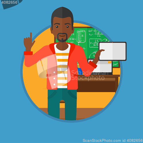 Image of Male student using tablet computer in classroom.
