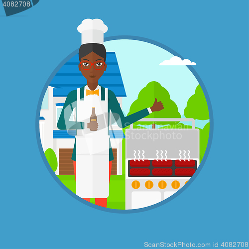 Image of Woman cooking meat on gas barbecue grill.