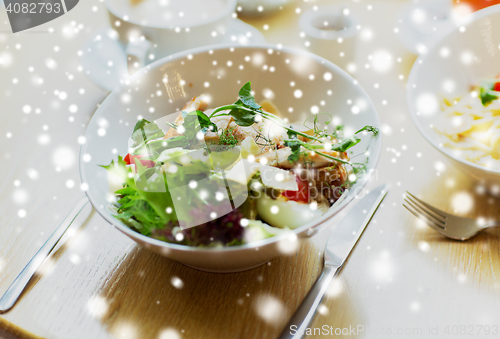 Image of close up of caesar salad on plate at restaurant