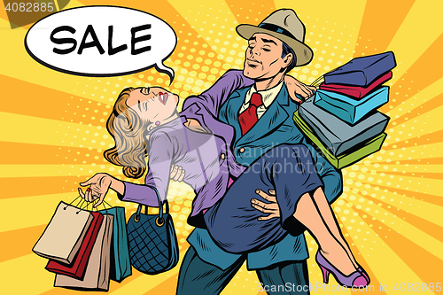 Image of Discounts and sales. Retro man carrying woman on his hands
