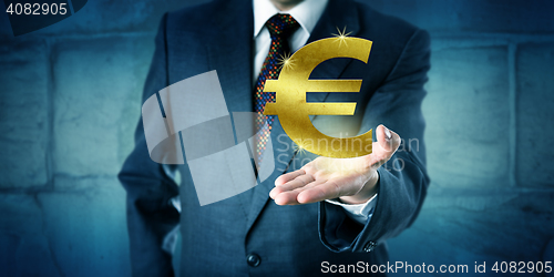 Image of Currency Trader Showing A Golden Euro Symbol