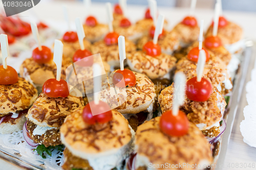 Image of close up of canape hamburgers on serving tray