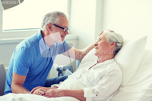 Image of senior couple meeting at hospital ward