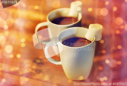 Image of cups of hot chocolate with marshmallow on wood