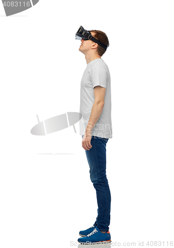 Image of happy man in virtual reality headset or 3d glasses