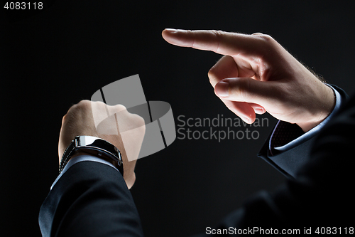 Image of close up of businessman hands with smart watch