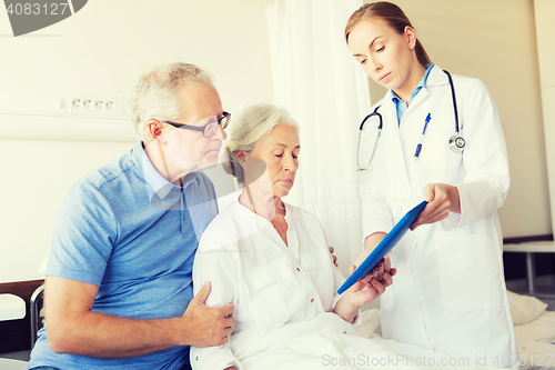 Image of senior woman and doctor with tablet pc at hospital