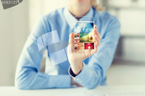 Image of close up of woman with application on smartphone