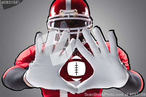 Image of The hands of american football player on white