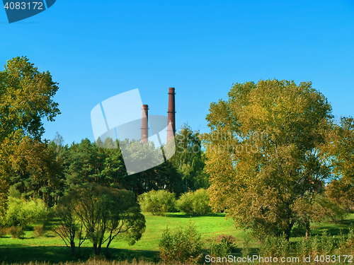 Image of park and smokestacks